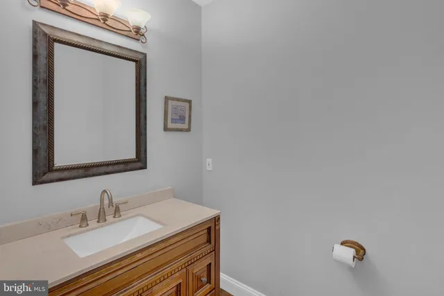 a living room with fireplace furniture and a wooden floor