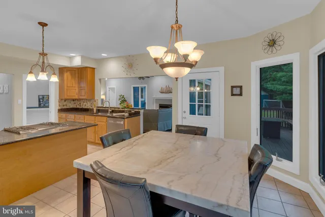 a bathroom with a bathtub sink vanity and mirror