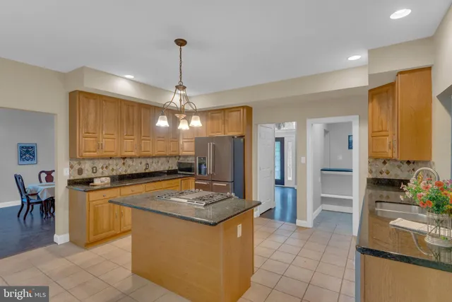 a bathroom with a tub sink and shower