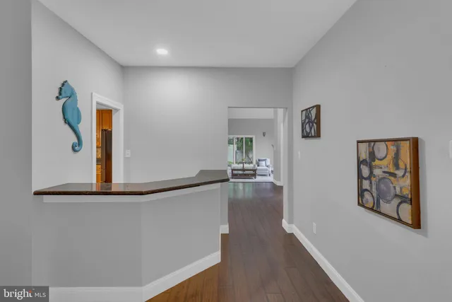 a spacious bathroom with a granite countertop tub sink and mirror