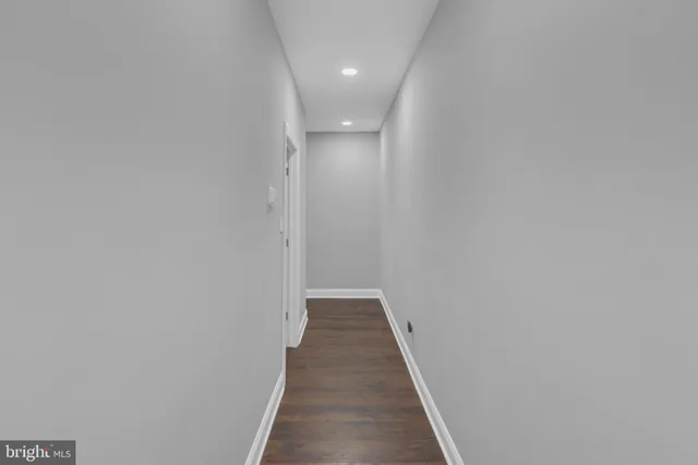 a view of a chair and table in backyard of the house