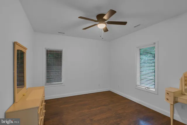 a view of a chair and tables in the backyard