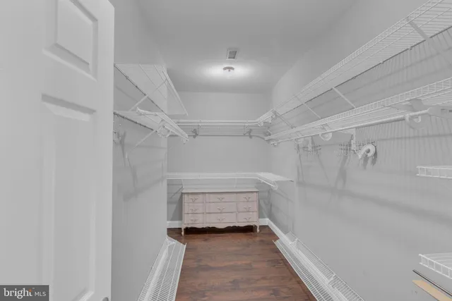 a view of a house with a tree and fence