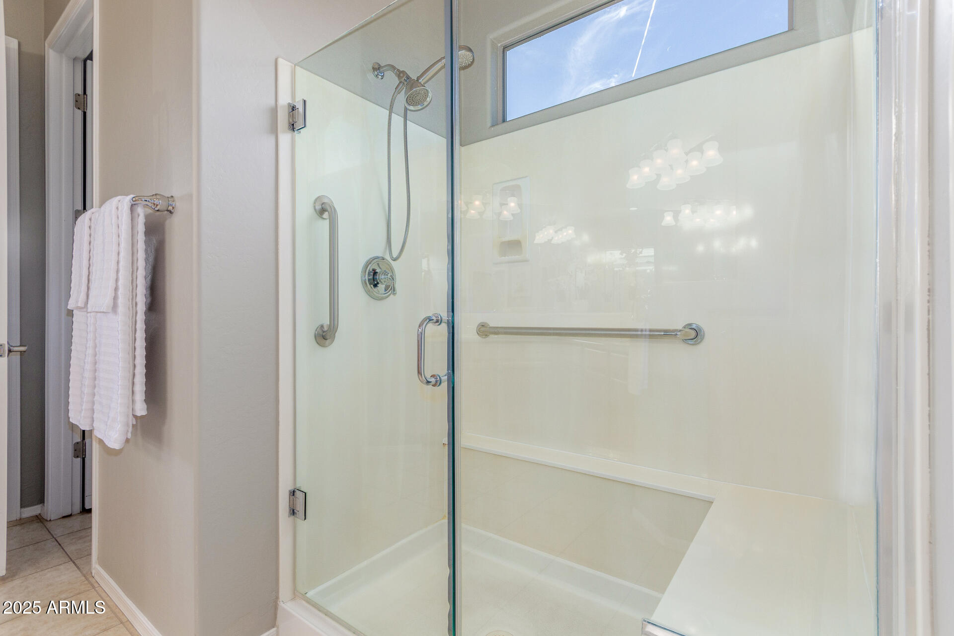 4553 East Narrowleaf Drive Gilbert, AZ 85298 - Photo 18 of 60 a bathroom with a glass shower door