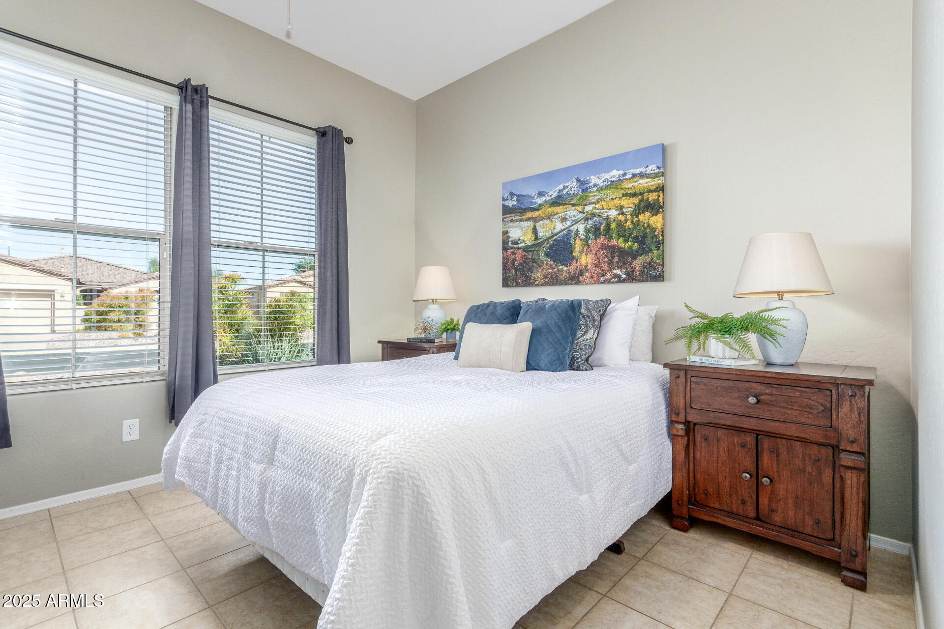 4553 East Narrowleaf Drive Gilbert, AZ 85298 - Photo 20 of 60 a bedroom with a bed and a painting on the wall
