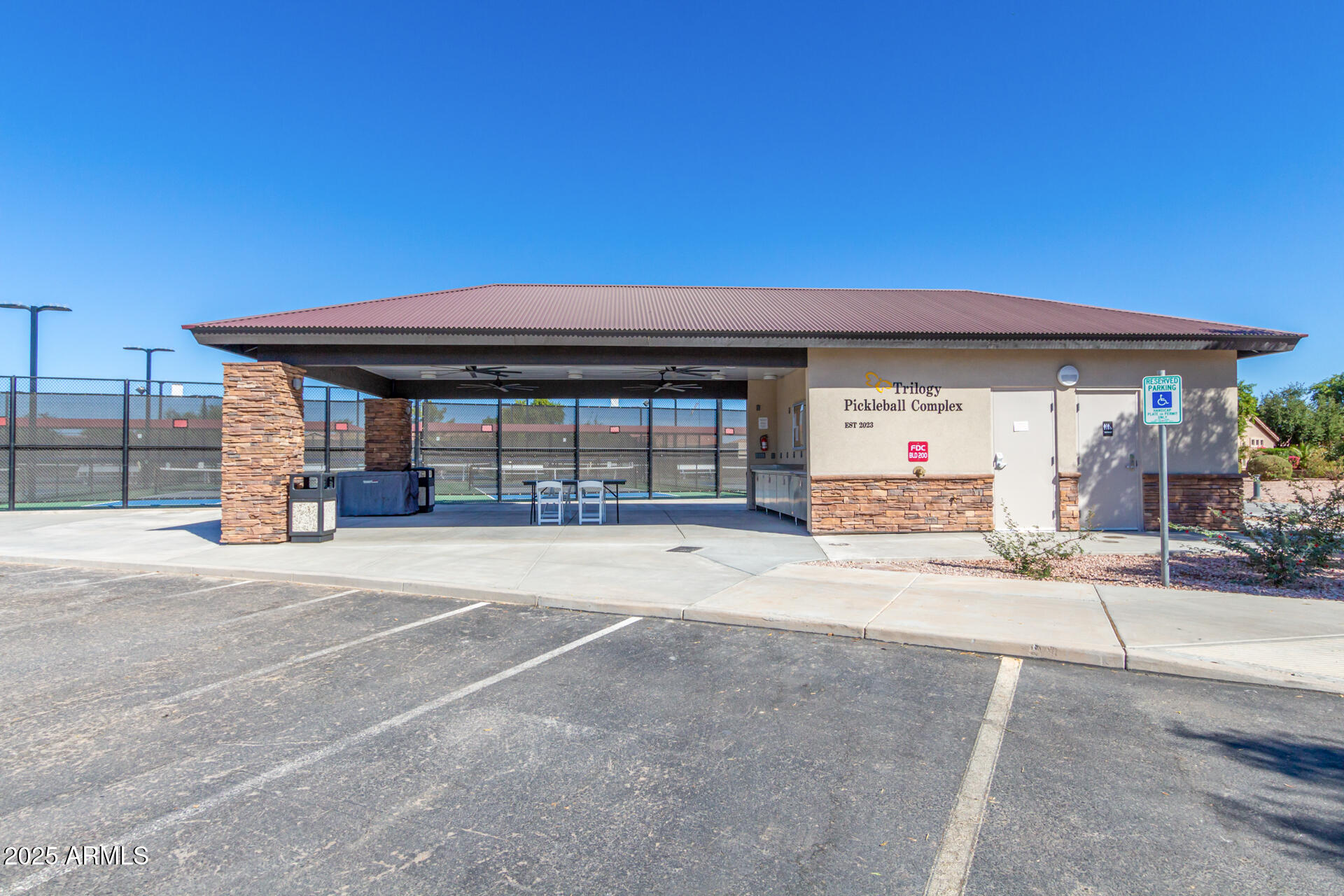 4553 East Narrowleaf Drive Gilbert, AZ 85298 - Photo 50 of 60 a front view of a house with basket ball court and a garage