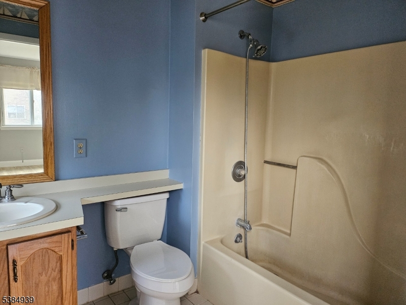 78 Falcon Ridge Way North, Unit 8 Hamburg, NJ 07419 - Photo 12 of 14 a bathroom with a granite countertop toilet sink and shower