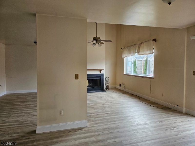 78 Falcon Ridge Way North, Unit 8 Hamburg, NJ 07419 - Photo 5 of 14 wooden floor in an empty room with a window