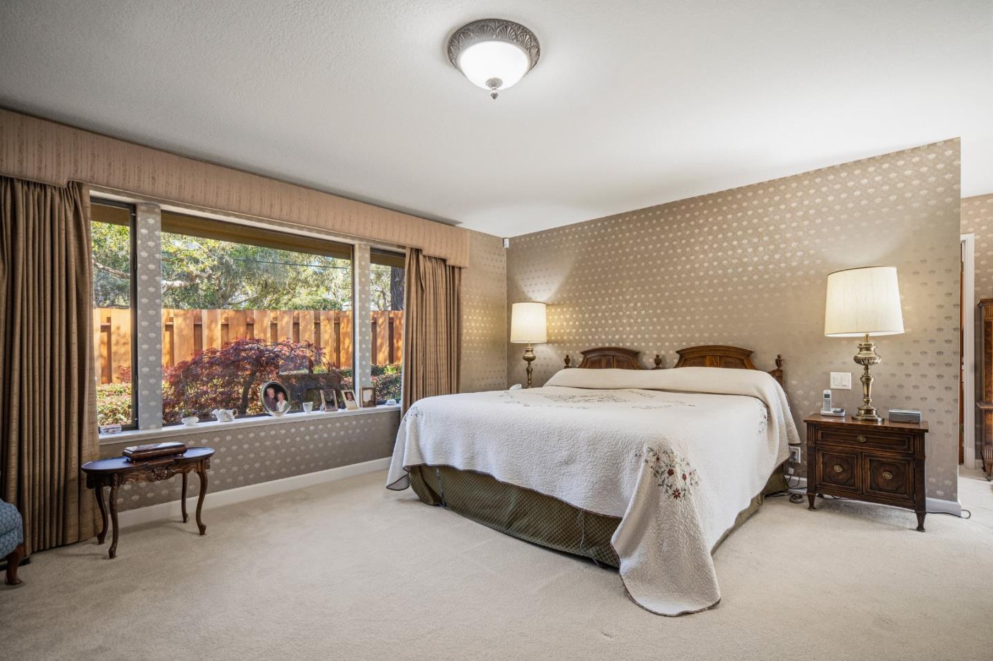 2911 Colton Road Pebble Beach, CA 93953 - Photo 24 of 46 a spacious bedroom with a bed and large window