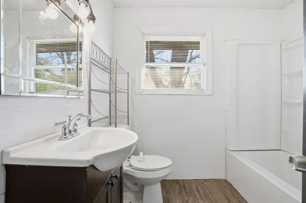 a bathroom with a sink toilet and a bathtub