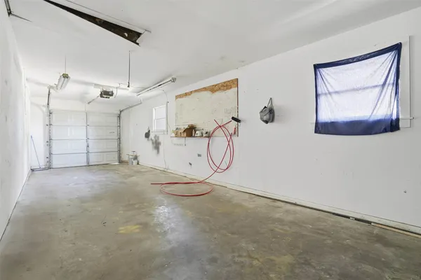 a view of a garage with wooden floor