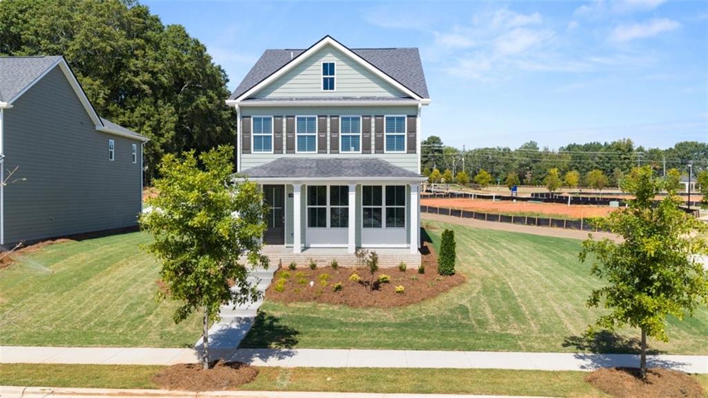 906 Stow Lane Monroe, GA 30655 - Photo 1 of 28 a front view of a house with a yard