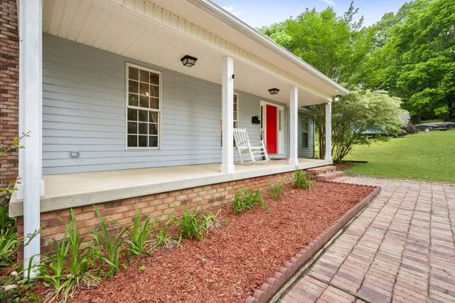 a front view of a house with garden