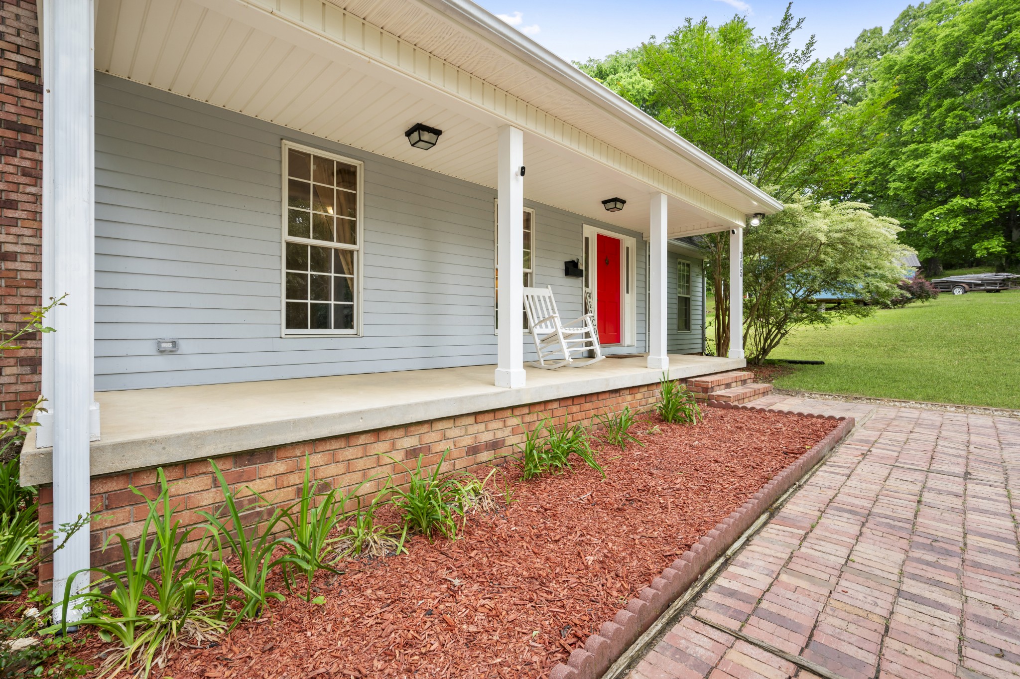 a front view of a house with garden