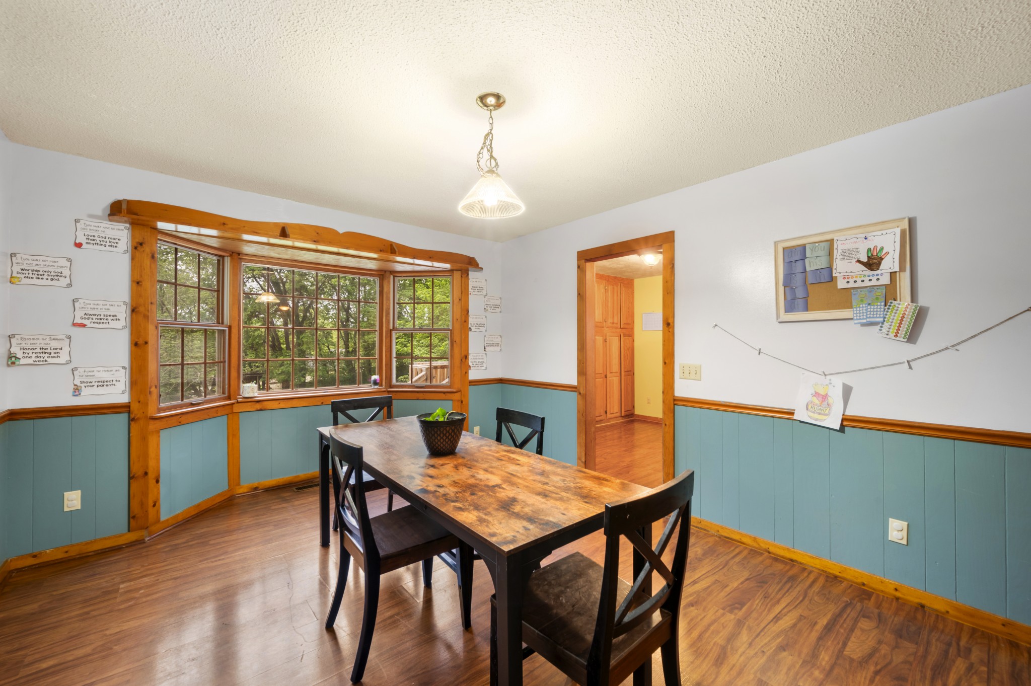 105 Flower Lane Paris, TN 38242 - Photo 12 of 25 a view of a dining room with furniture window and wooden floor
