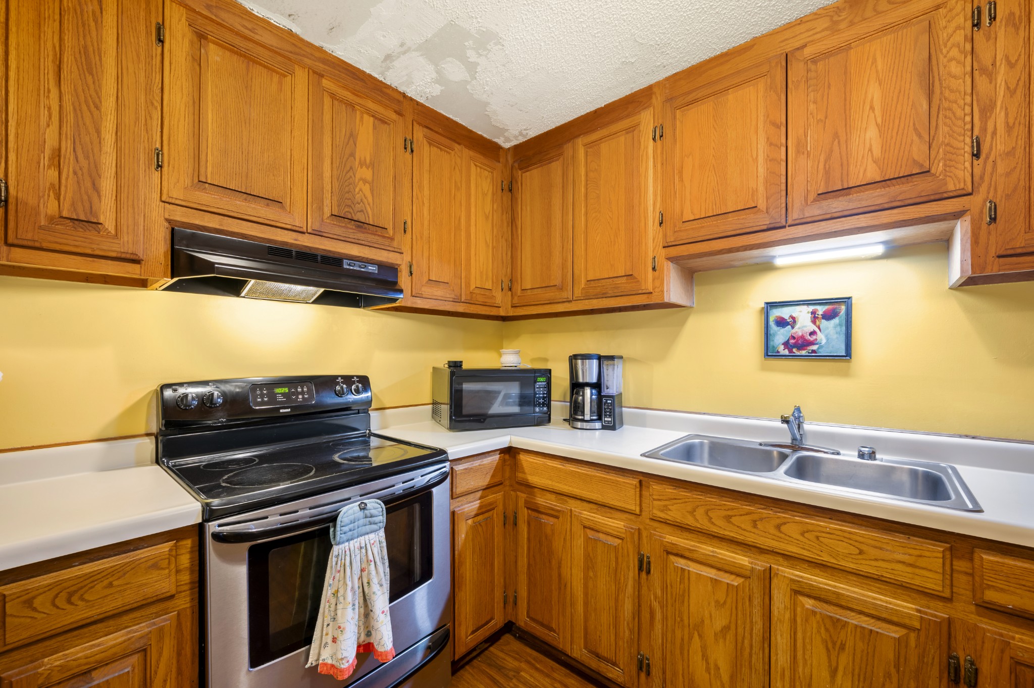 105 Flower Lane Paris, TN 38242 - Photo 14 of 25 a kitchen with stainless steel appliances granite countertop a stove and a sink