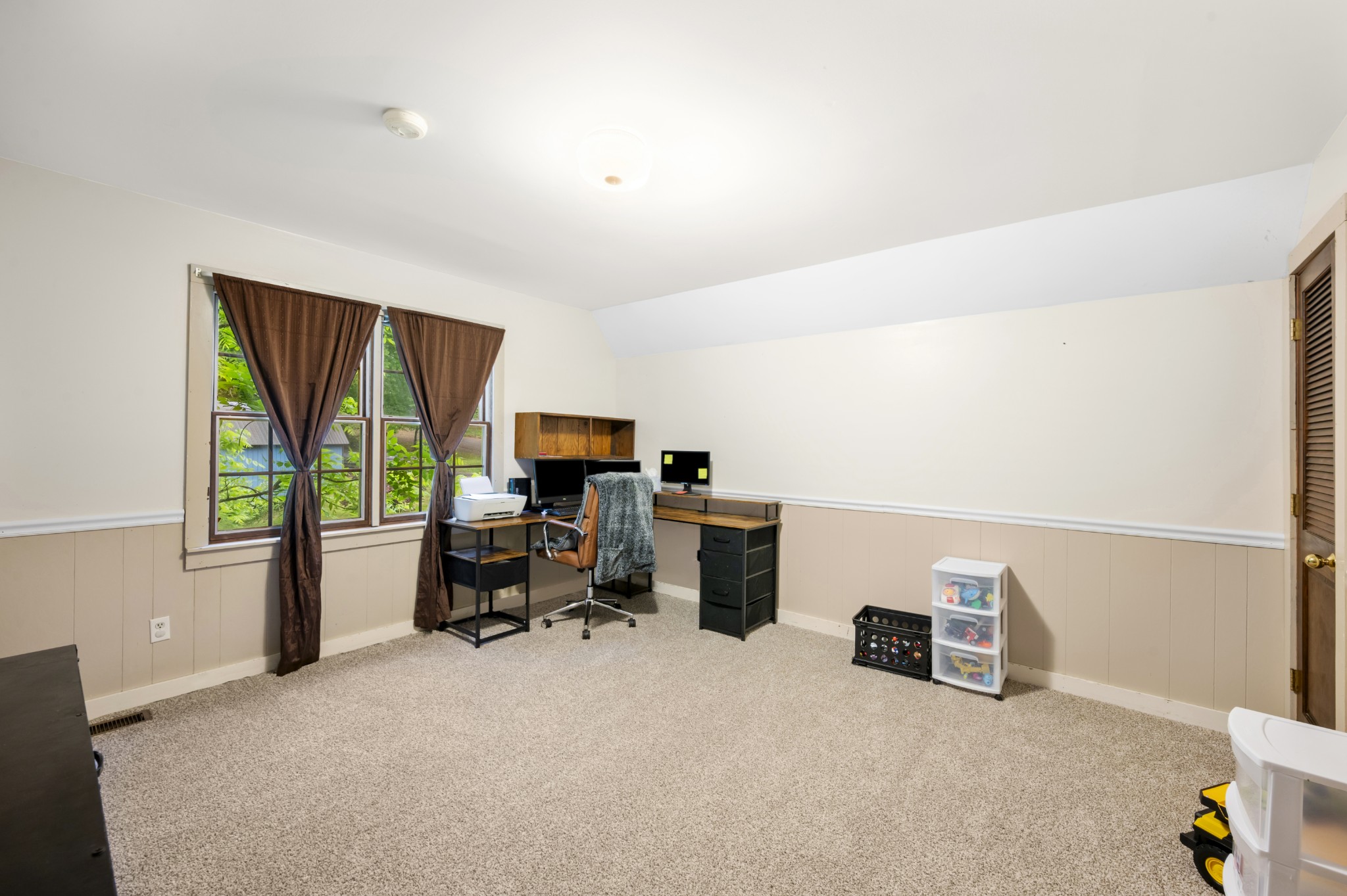 105 Flower Lane Paris, TN 38242 - Photo 18 of 25 a view of a workspace with furniture and a window