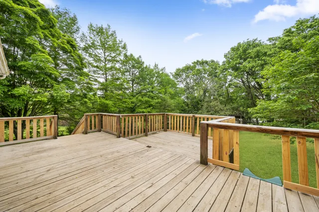 a view of balcony with deck and wooden floor