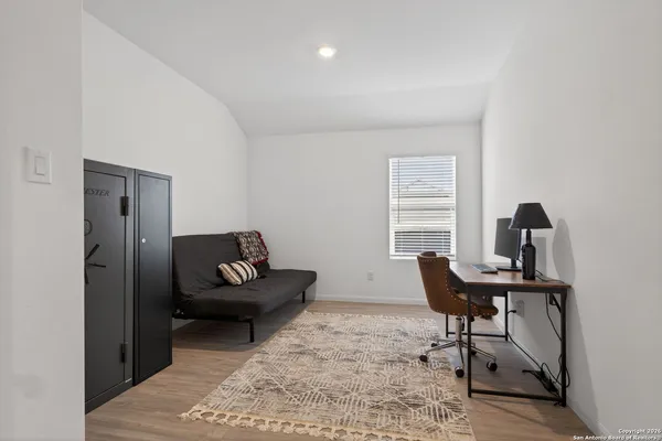 a workspace with furniture and a window