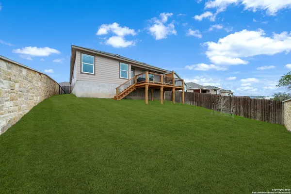 a backyard of a house with lots of green space