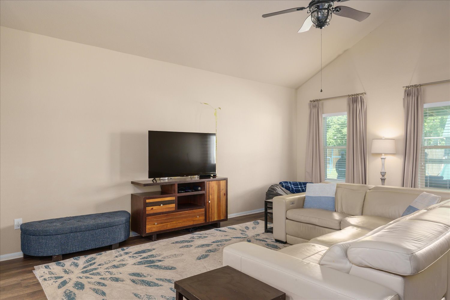 717 Kaluga Trail Leander, TX 78641 - Photo 8 of 40 a living room with furniture and a flat screen tv
