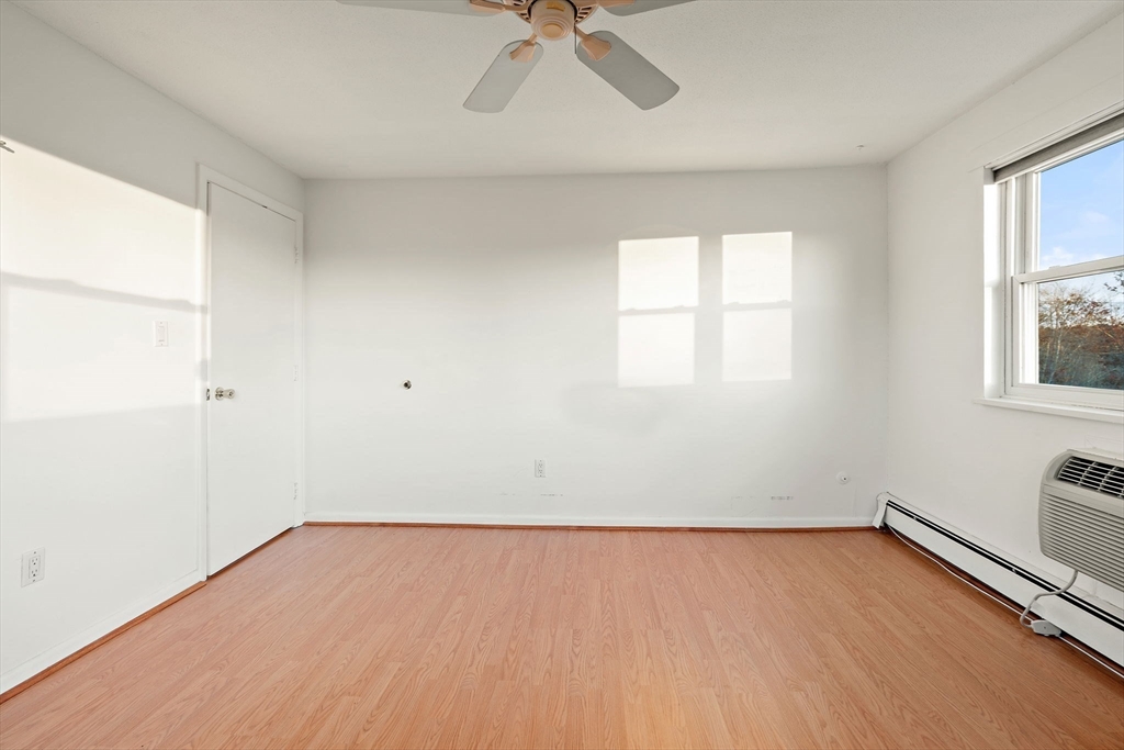 1 Colonial Drive, Unit B18 Andover, MA 01810 - Photo 10 of 25 an empty room with a window