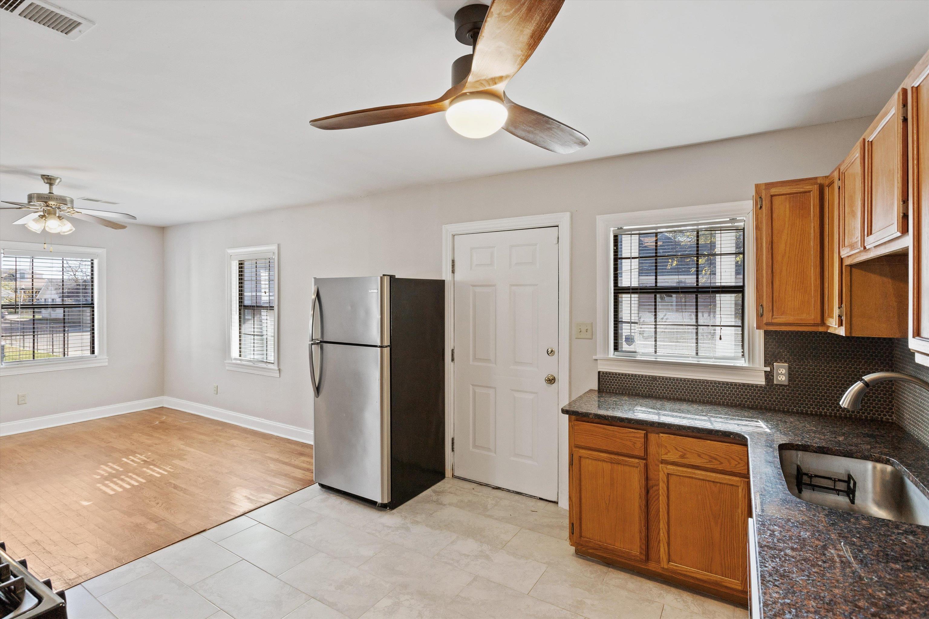 1011 Philadelphia Street Memphis, TN 38104 - Photo 11 of 26 a kitchen with stainless steel appliances granite countertop a refrigerator and a sink