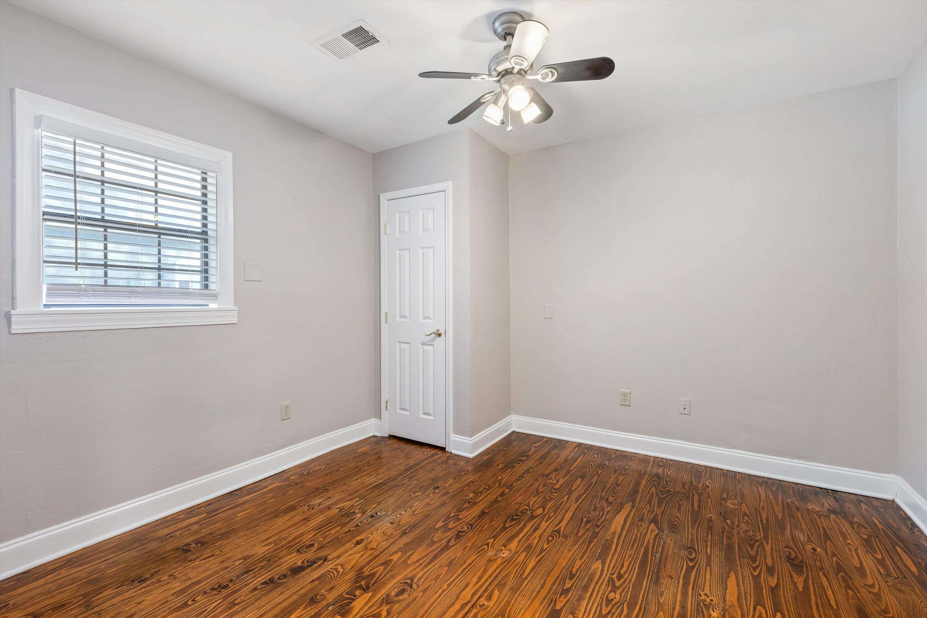 1011 Philadelphia Street Memphis, TN 38104 - Photo 14 of 26 wooden floor in an empty room with a window