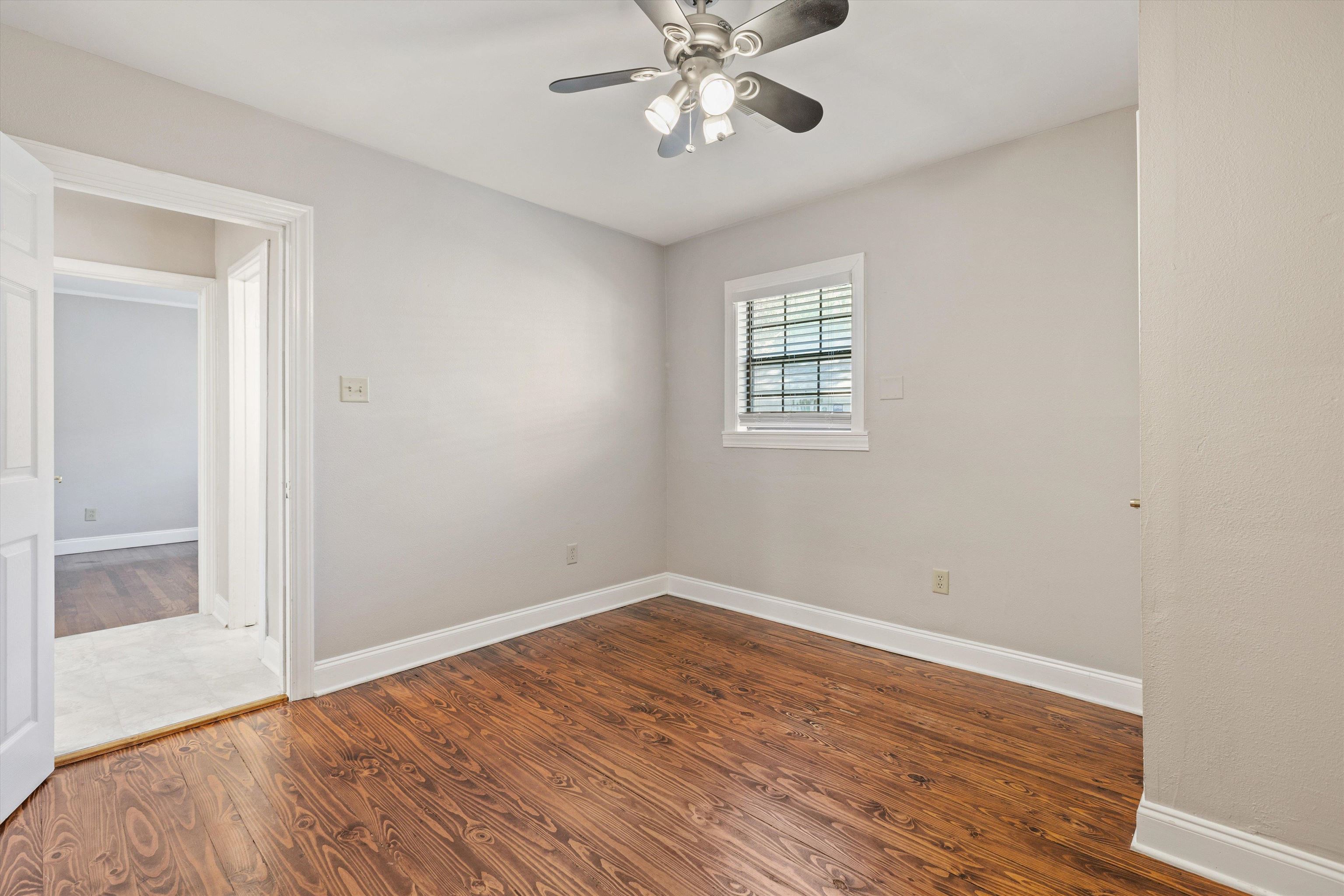 1011 Philadelphia Street Memphis, TN 38104 - Photo 15 of 26 wooden floor in an empty room with a window