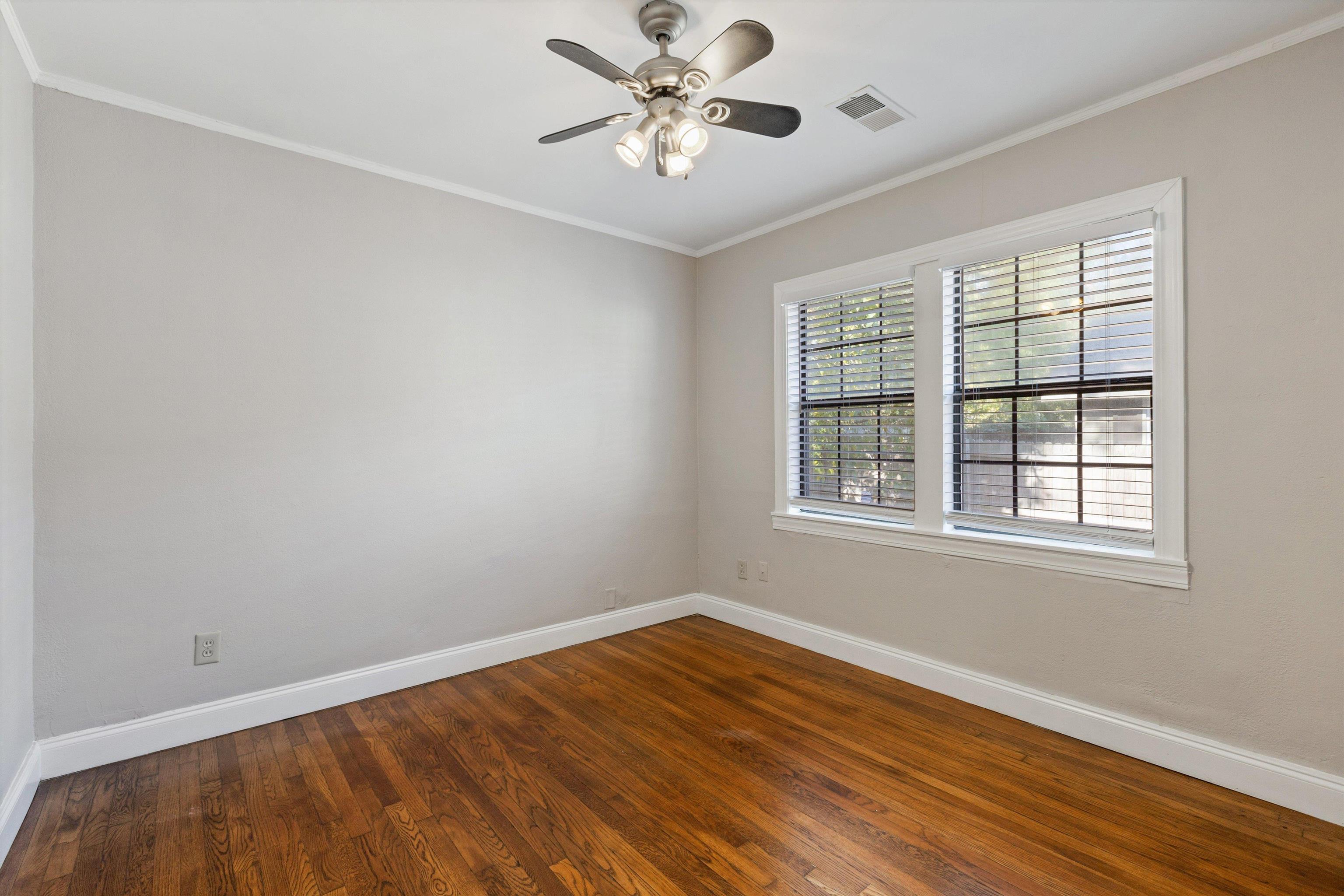 1011 Philadelphia Street Memphis, TN 38104 - Photo 18 of 26 a view of an empty room with window and wooden floor