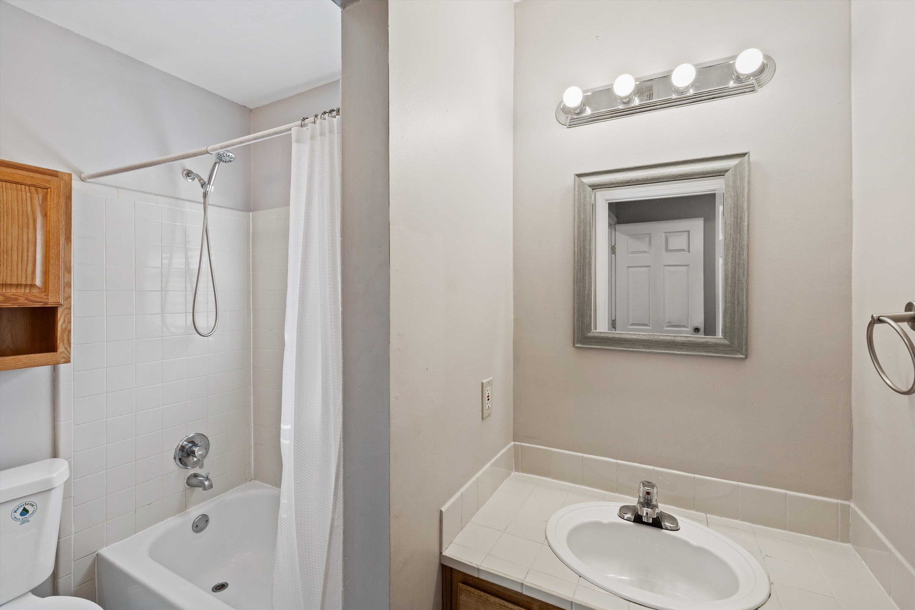 1011 Philadelphia Street Memphis, TN 38104 - Photo 20 of 26 a bathroom with a sink a toilet and shower