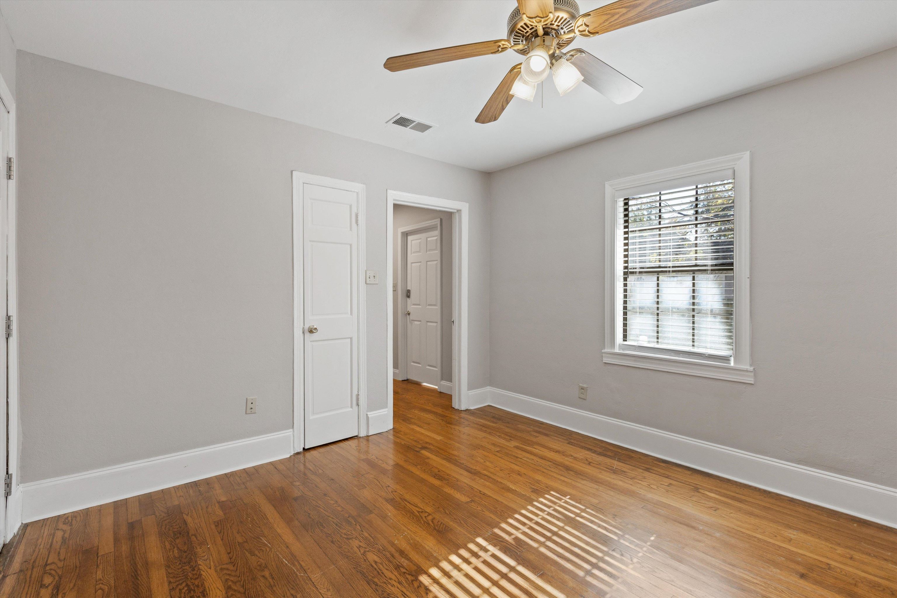 1011 Philadelphia Street Memphis, TN 38104 - Photo 22 of 26 a view of an empty room with wooden floor and a window