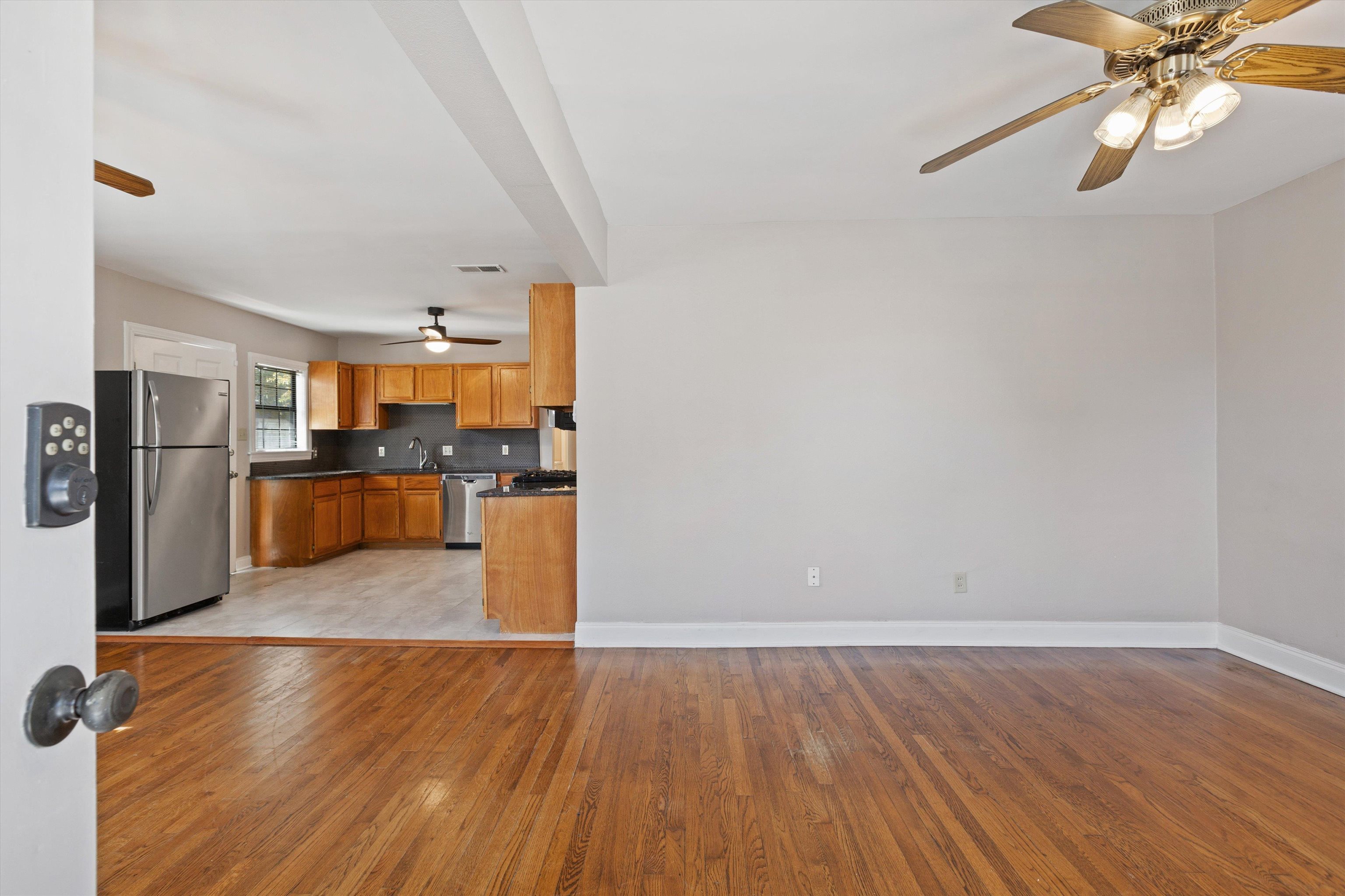 1011 Philadelphia Street Memphis, TN 38104 - Photo 5 of 26 a view of a kitchen with wooden floor and a kitchen
