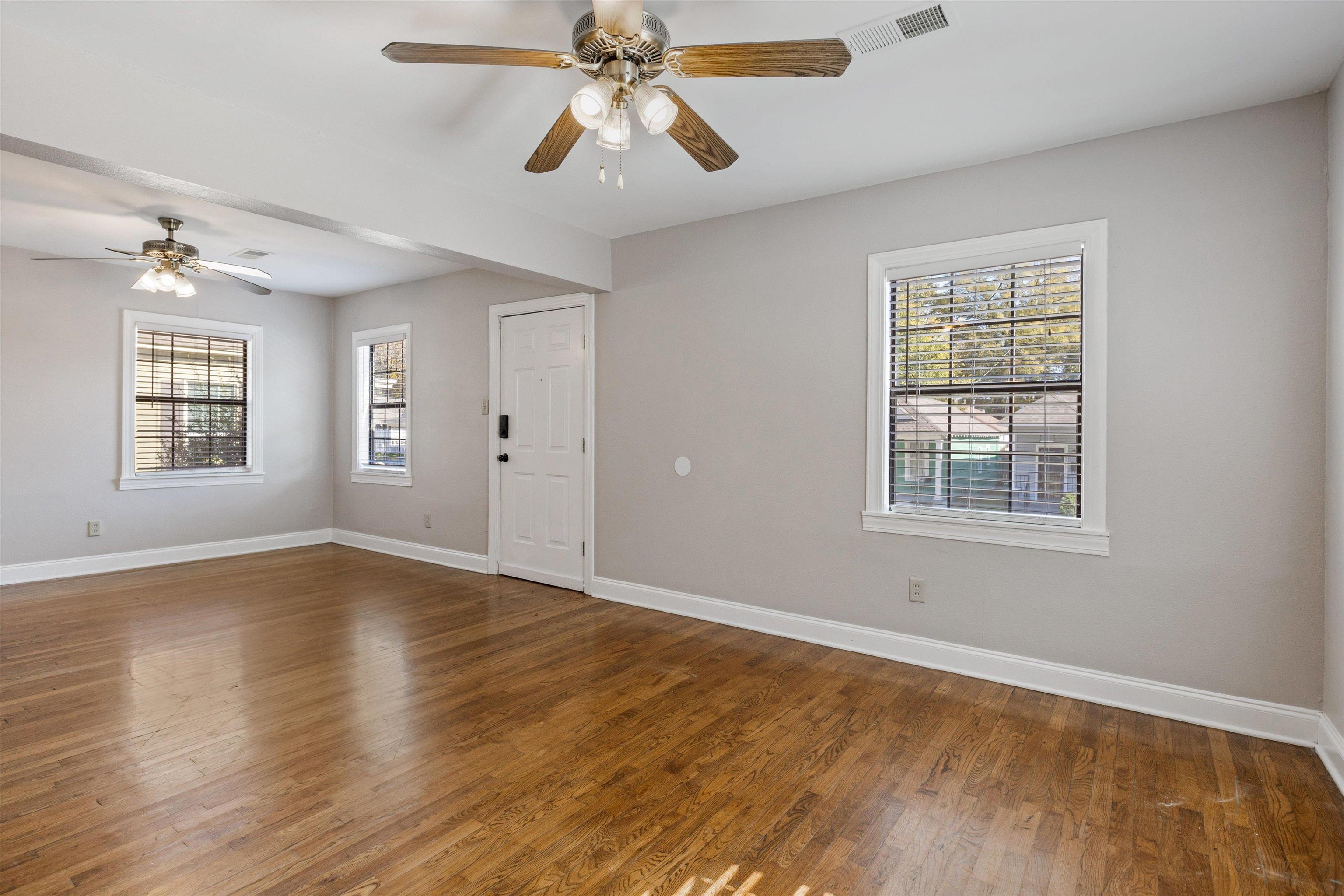 1011 Philadelphia Street Memphis, TN 38104 - Photo 9 of 26 wooden floor in an empty room with a window