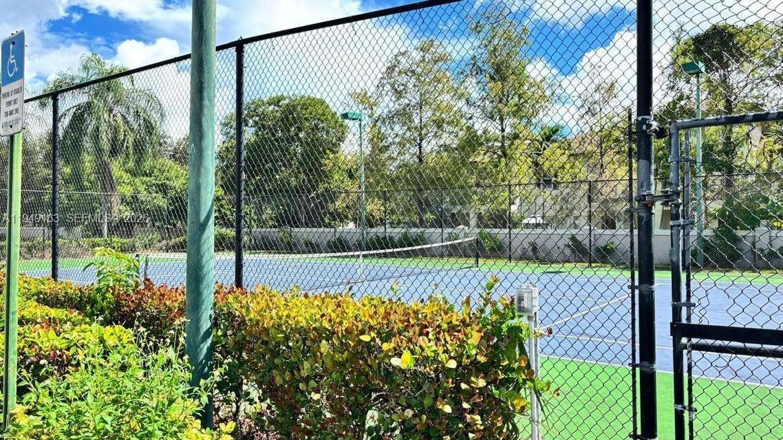 8821 Wiles Road, Unit 101 Coral Springs, FL 33067 - Photo 14 of 16 a view of a backyard with a garden