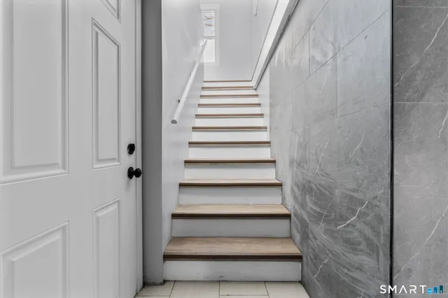 a view of hallway with wooden floor