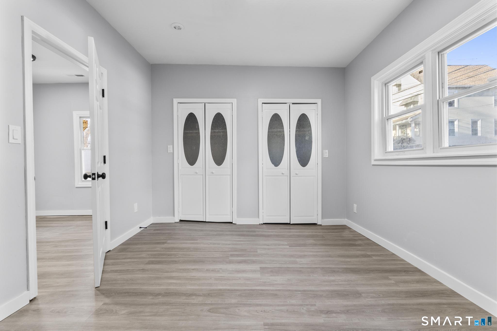 257 North State Street Ansonia, CT 06401 - Photo 25 of 39 a view of room with window and hardwood floor