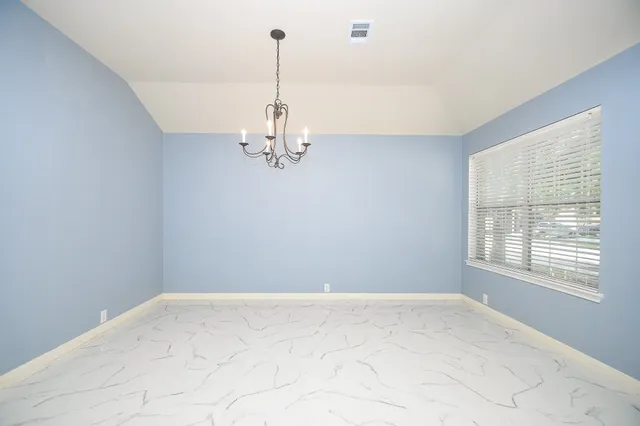 a view of a room with windows