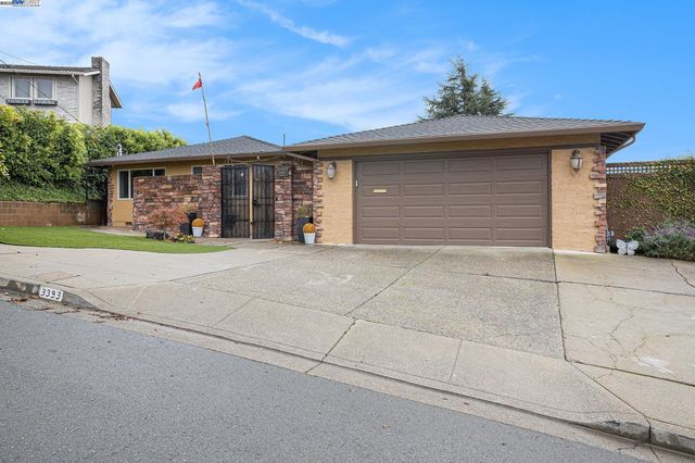 a front view of a house with a garage