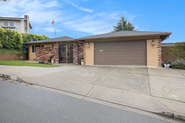 a front view of a house with a garage