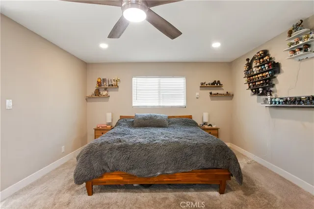a bathroom with a double vanity sink toilet and shower