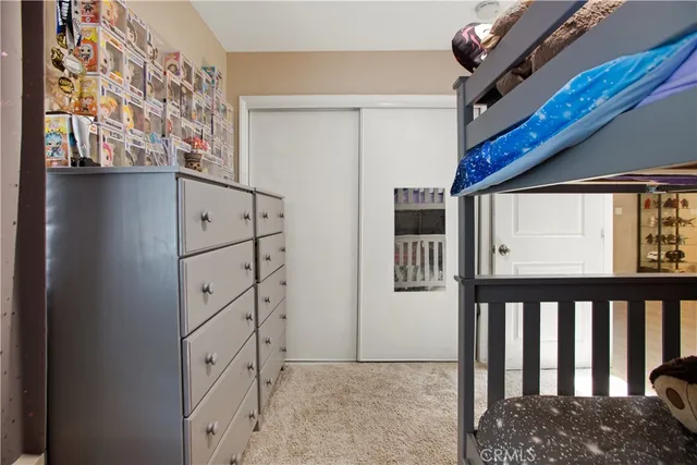 a bathroom with a toilet a sink and a shower curtain
