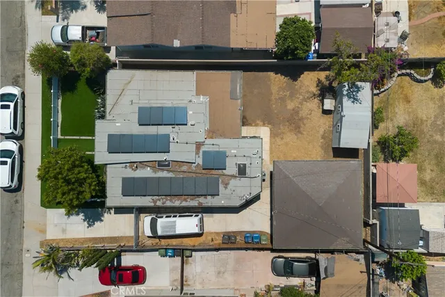 an aerial view of a houses with yard