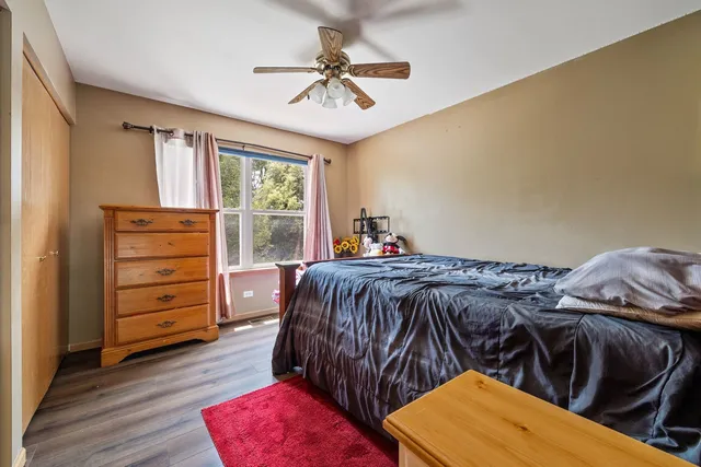 a bedroom with a bed and a closet