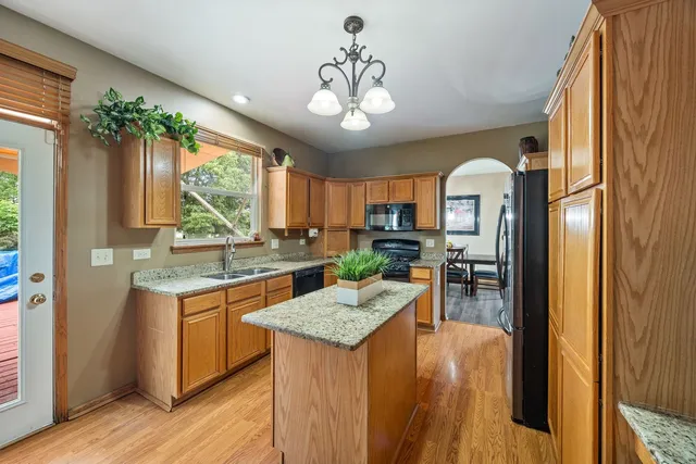 a kitchen that has a lot of counter space and a table in it