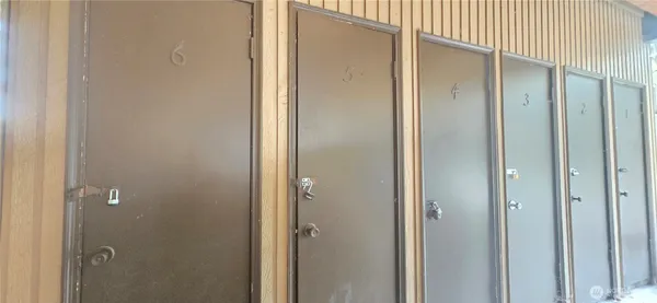 a bathroom with a glass shower door
