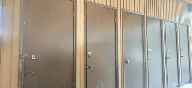 a bathroom with a glass shower door