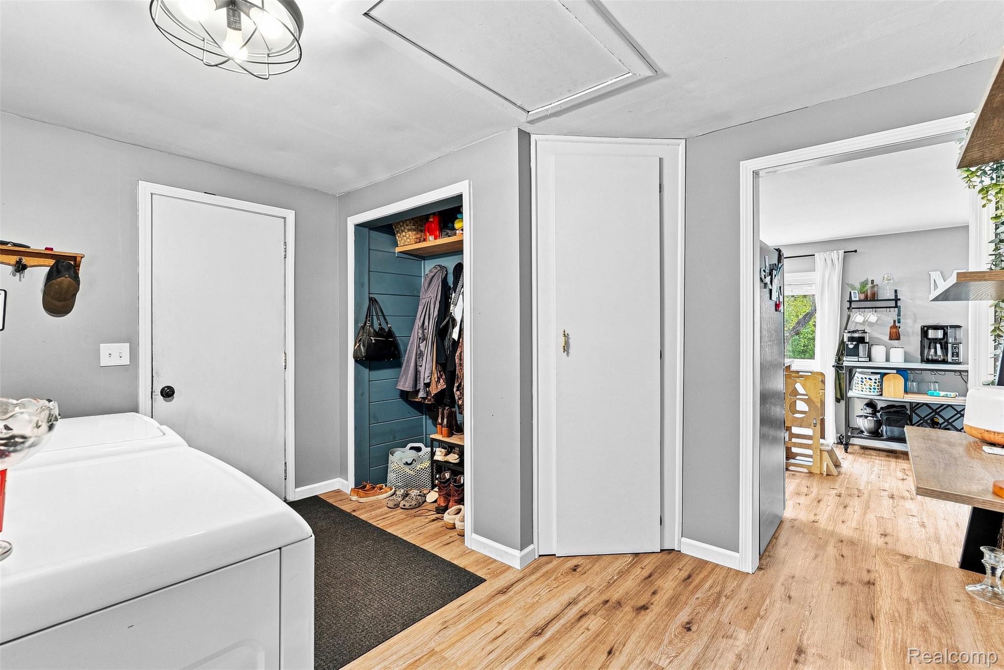 3319 Valentine Road Lapeer, MI 48446 - Photo 23 of 39 Wood-finish flooring throughout, bright white doors, and a built-in storage area with wood shelving