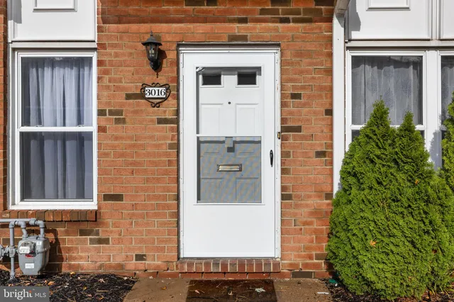 a front view of a house with a door and a shower