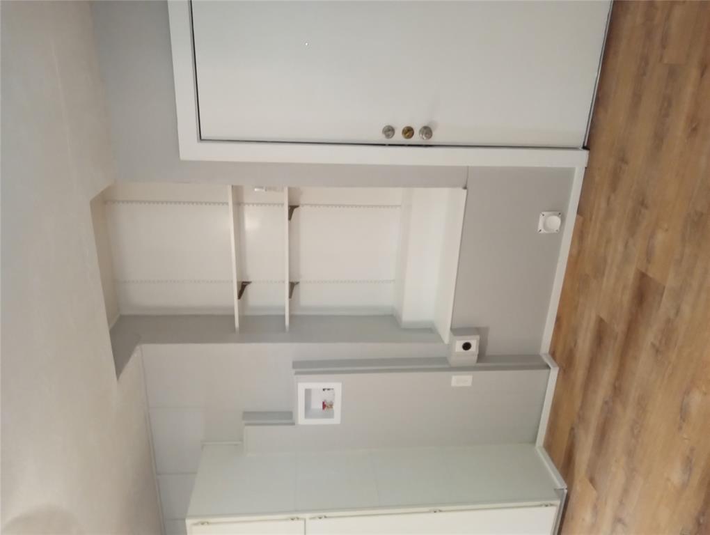 4500 Avenue D, Unit B Austin, TX 78751 - Photo 10 of 16 Laundry room featuring light wood-style flooring and hookup for a washing machine
